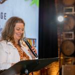 Beyond Hunger CEO Michele Zurakowski giving a welcome speech